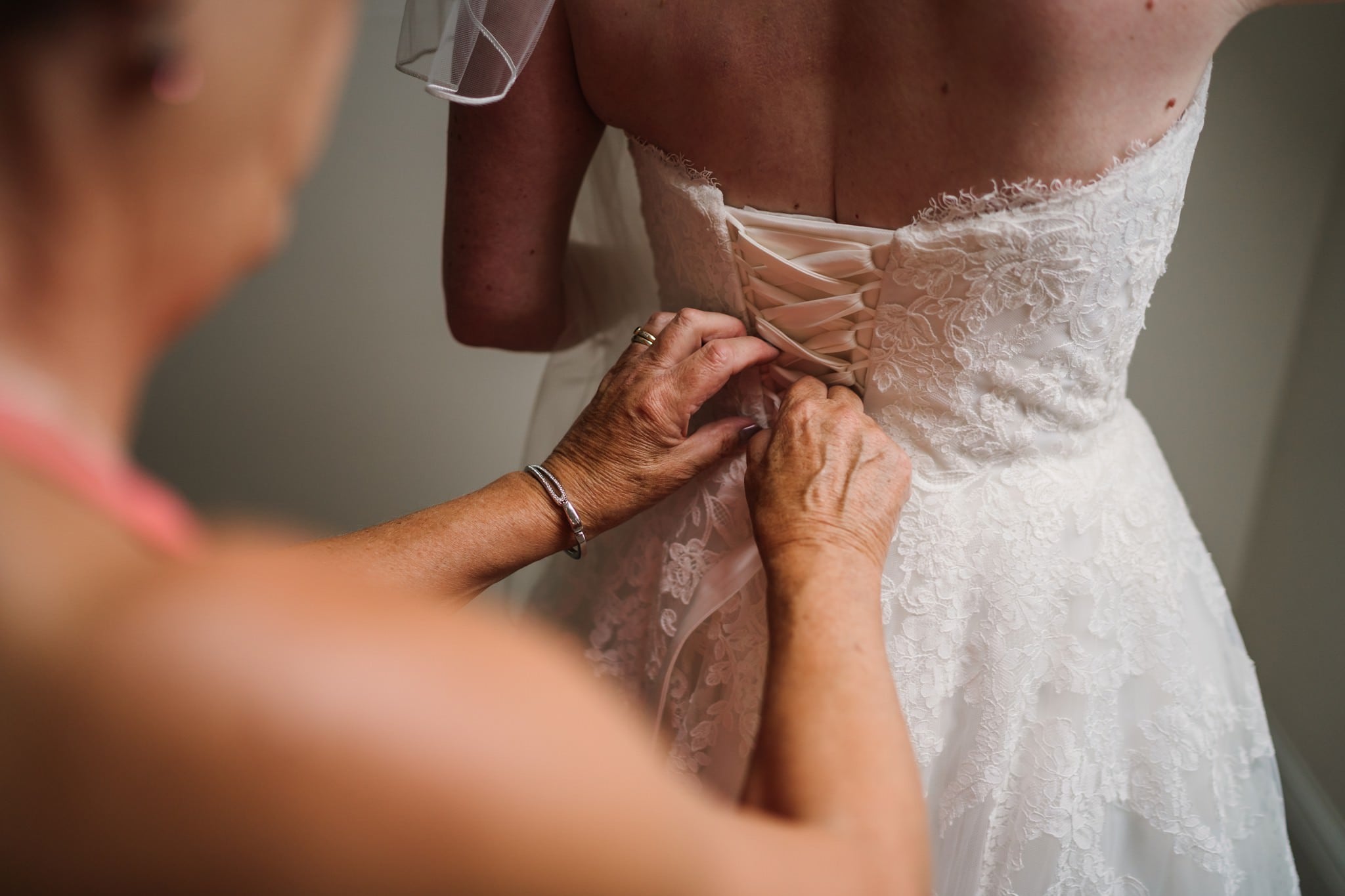 Lace up wedding corset dress at Three Choirs Vineyard wedding