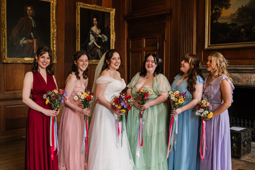 Colourful mismatched bridesmaids dresses at Taunton wedding