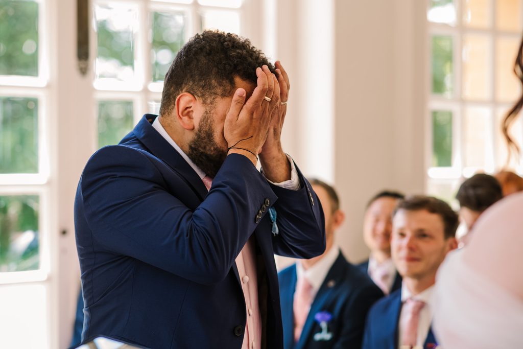 Photo of emotional groom at Taunton wedding