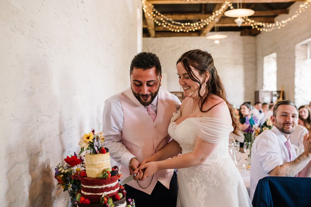Cutting the cake at Hestercombe Wedding