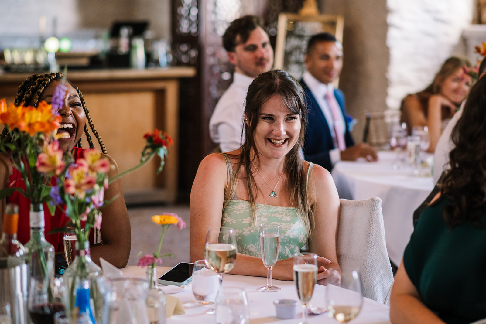 Guests laughing at speeches at Hestercombe Wedding